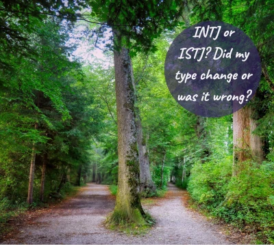 Forest path split by tree with text INTJ or ISTJ? Did my type change or was it wrong?
