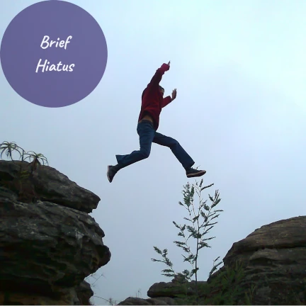 Person jumping over a chasm with the text Brief Hiatus